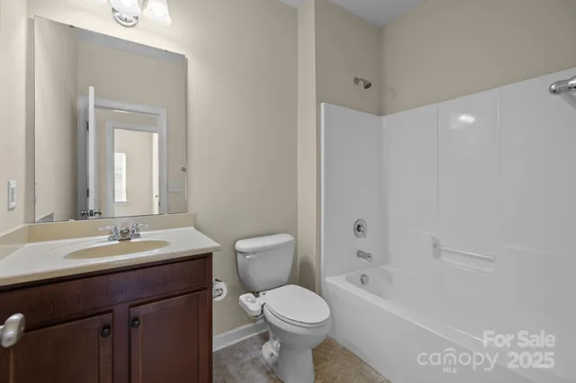 a bathroom with a toilet a sink and a bathtub