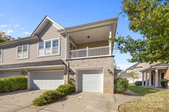 a view of a house with a yard and plants