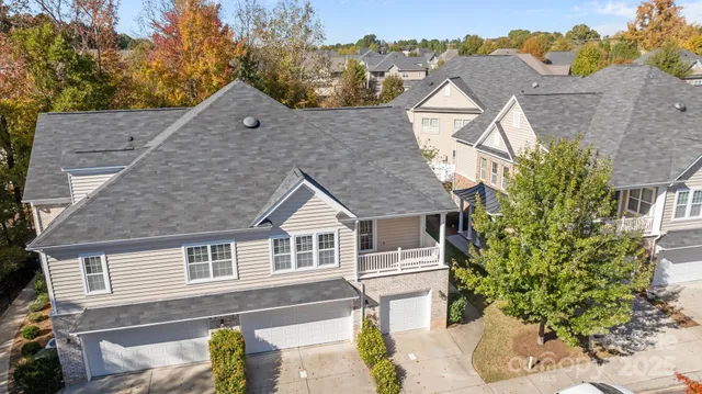 a aerial view of a house with a yard