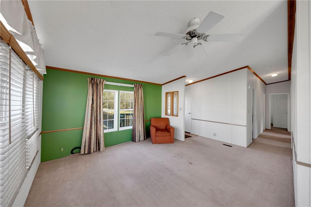 1320 Hidden Valley Road Bulger, PA 15019 - Photo 8 of 33 a view of a livingroom with furniture and a ceiling fan