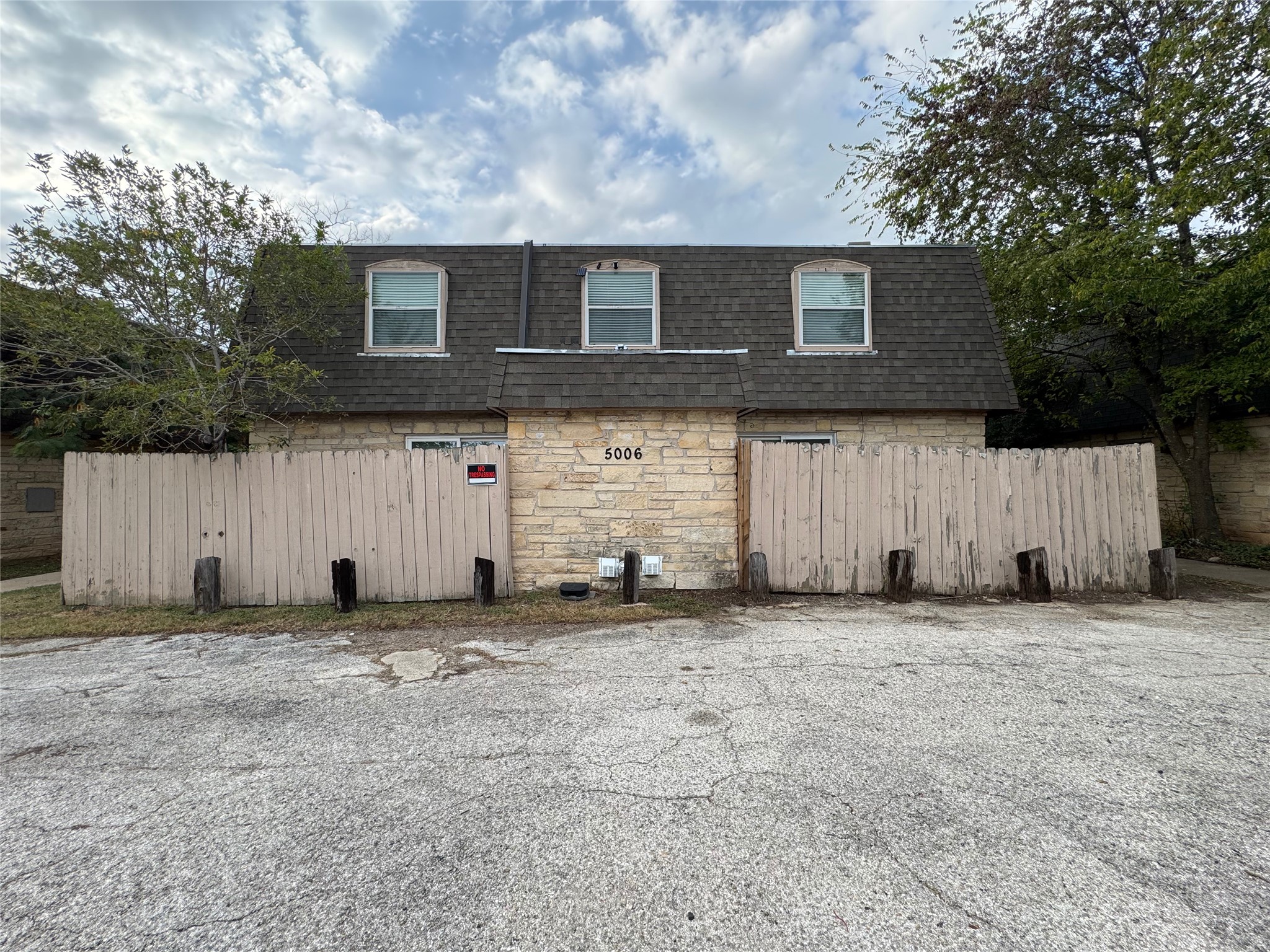 5006 West Wind Trail, Unit 101 Austin, TX 78745 - Photo 1 of 18 a backyard of a house