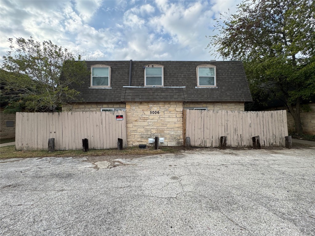 5006 West Wind Trail, Unit 101 Austin, TX 78745 - Photo 1 of 18 a backyard of a house