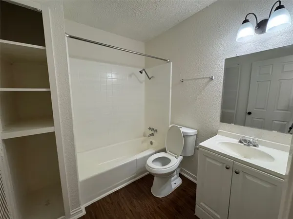 a bathroom with a sink toilet a shower and bathtub