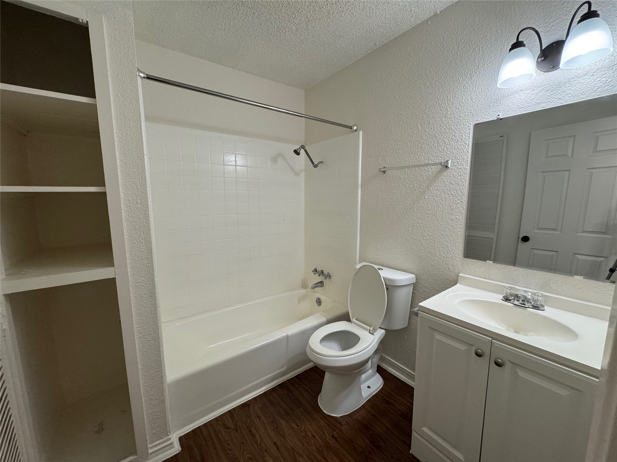 5006 West Wind Trail, Unit 101 Austin, TX 78745 - Photo 15 of 18 a bathroom with a sink toilet a shower and bathtub