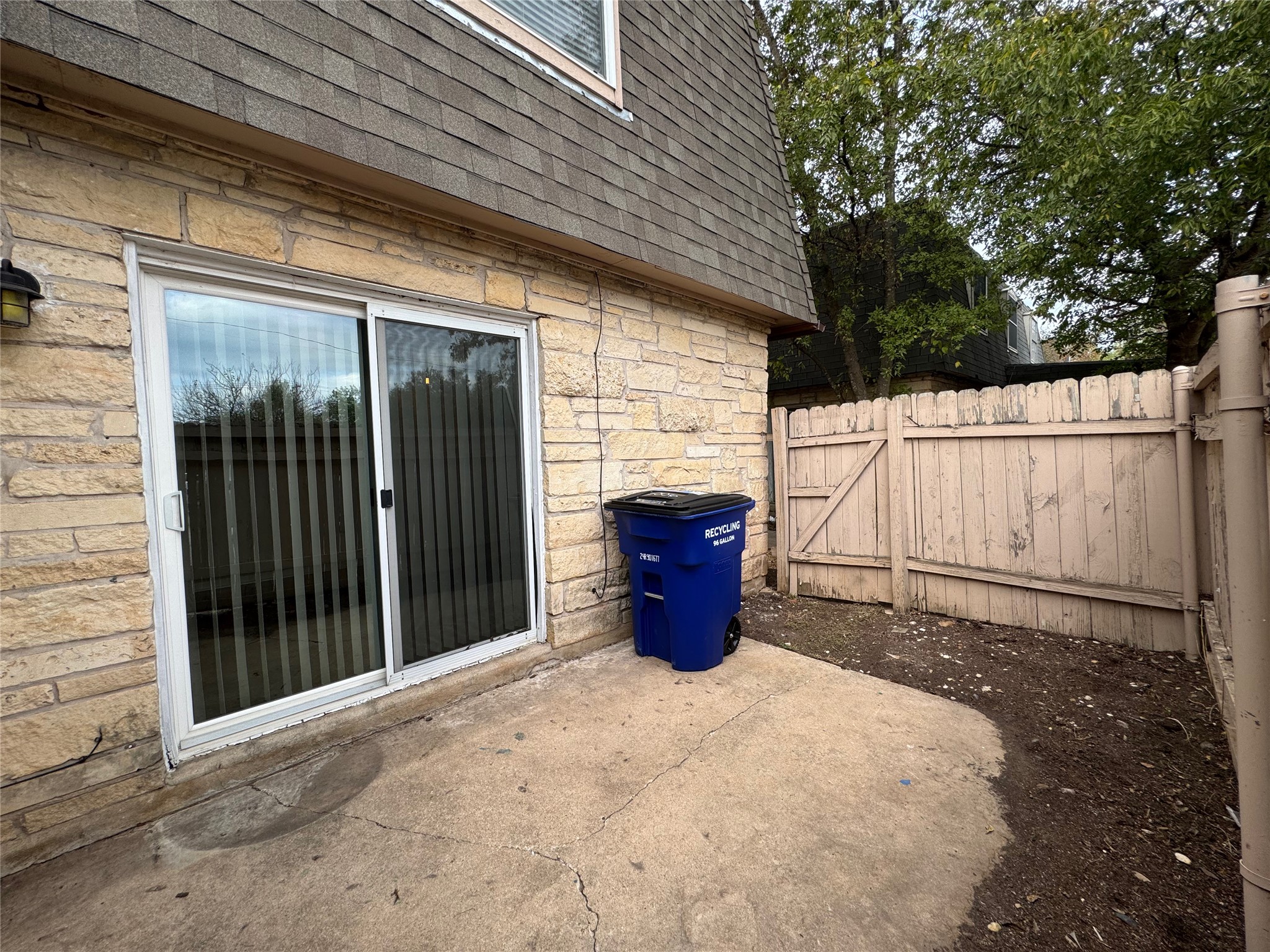 5006 West Wind Trail, Unit 101 Austin, TX 78745 - Photo 17 of 18 a view of a backyard