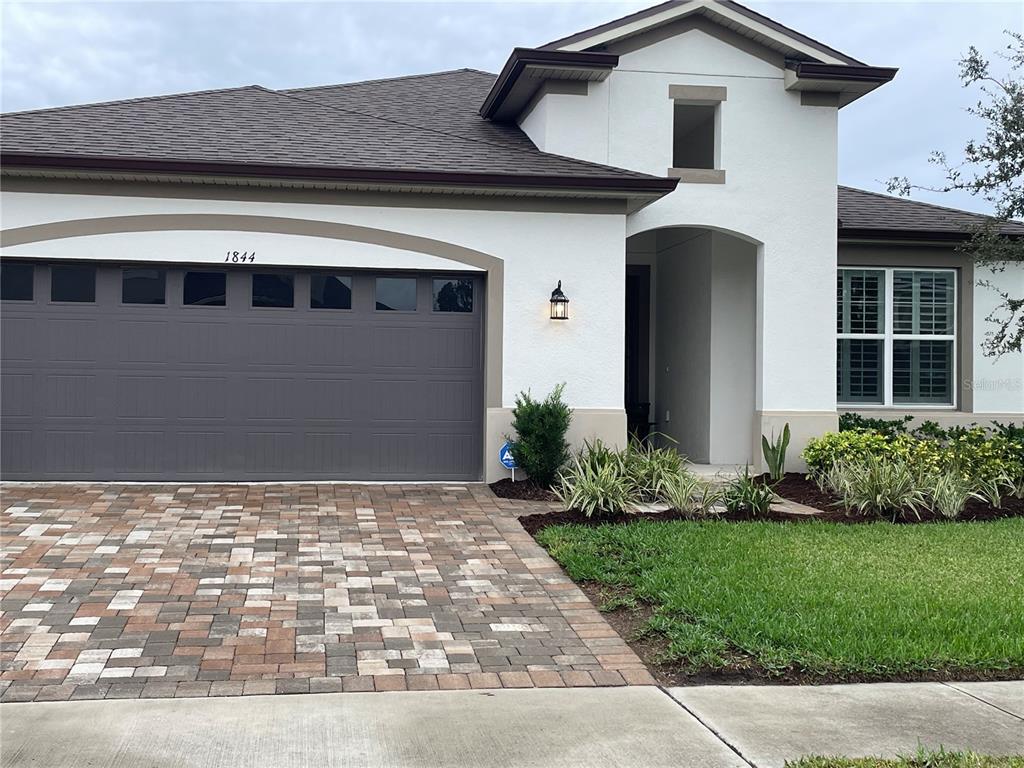 1844 Farnham Drive Ocoee, FL 34761 - Photo 1 of 1 a front view of a house with a yard