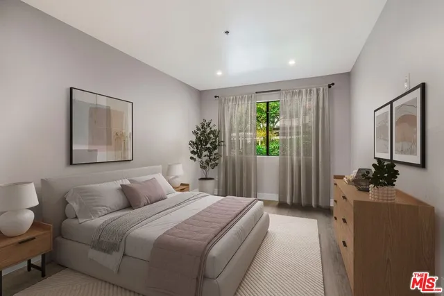 a bedroom with a balcony a bed and a large mirror