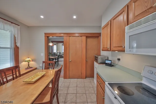 a kitchen that has a lot of cabinets a sink and a stove in it