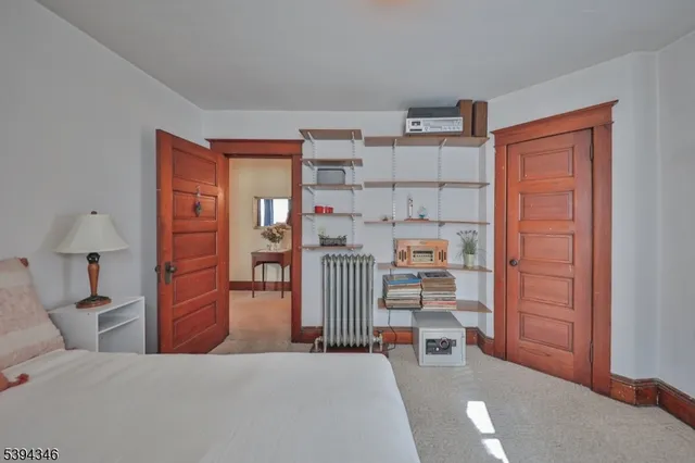 a bedroom with furniture and a wooden floor