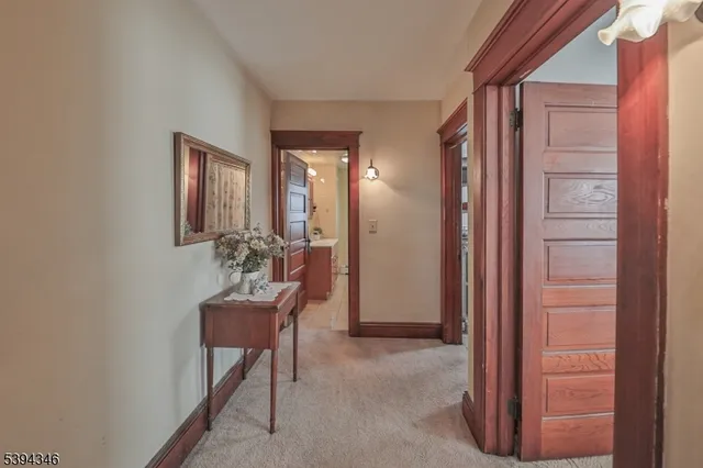 a view of a hallway with seating area