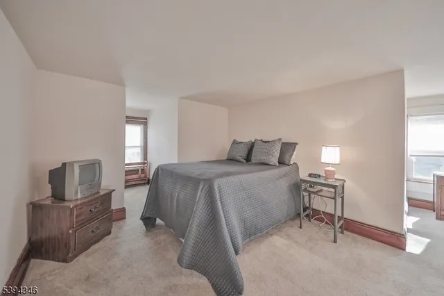 a view of a livingroom with furniture and windows