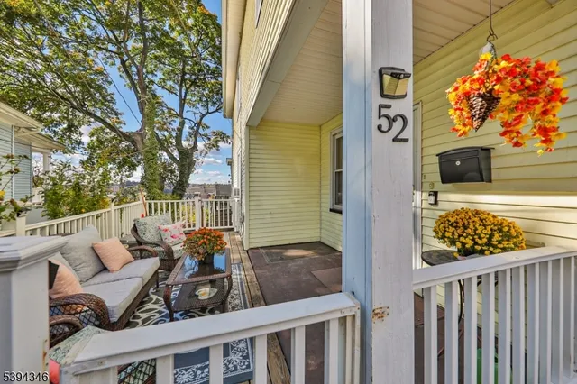 a view of a wooden bench in the porch