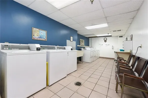 a room with furniture a washer and dryer