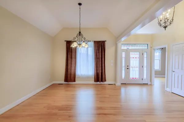 a living room with furniture a fireplace and a window