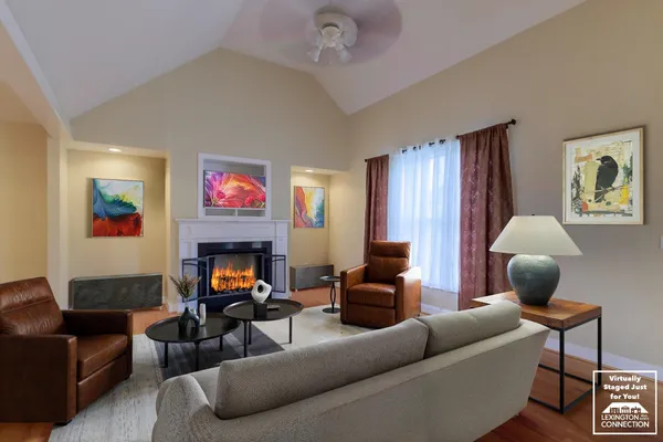 a view of an empty room with a fireplace and a window