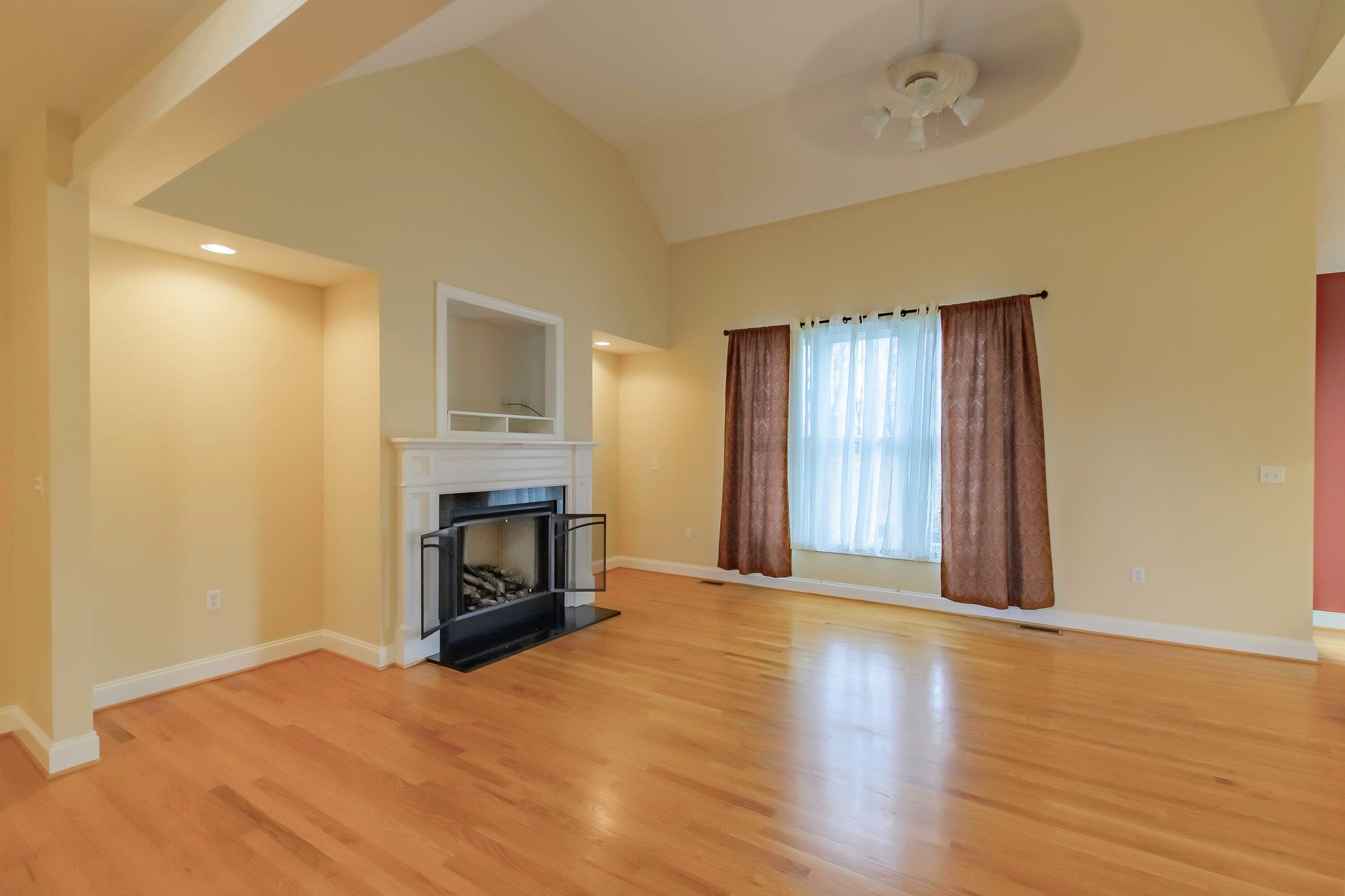 120 Springridge Lane Fairfield, VA 24435 - Photo 18 of 56 a view of an empty room with a fireplace and a window