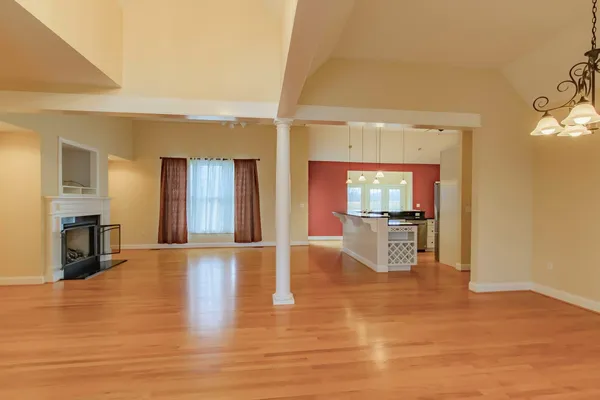 a kitchen with stainless steel appliances granite countertop a sink a refrigerator and a stove