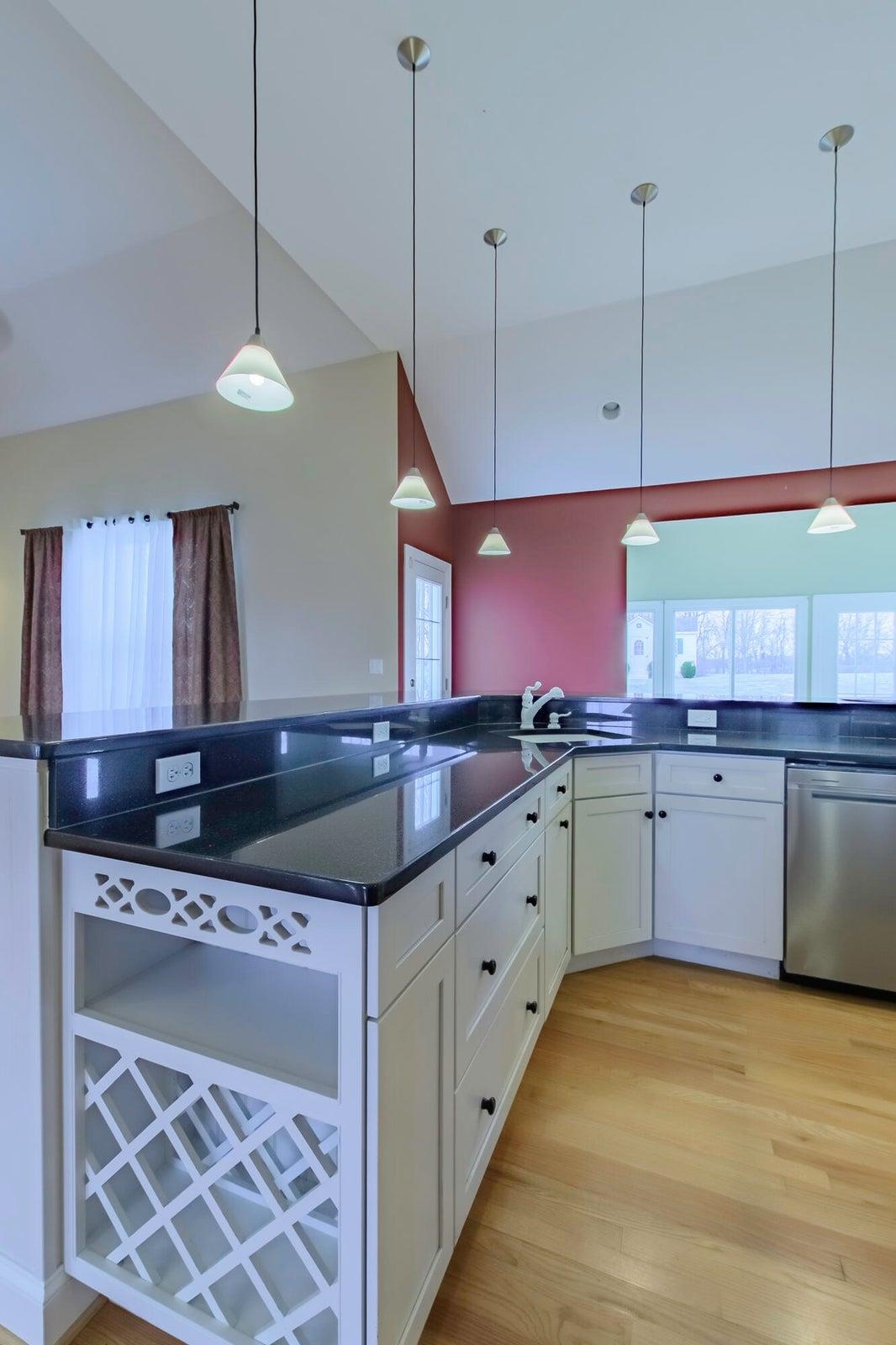120 Springridge Lane Fairfield, VA 24435 - Photo 28 of 56 a kitchen with stainless steel appliances granite countertop a sink a stove and a wooden floor