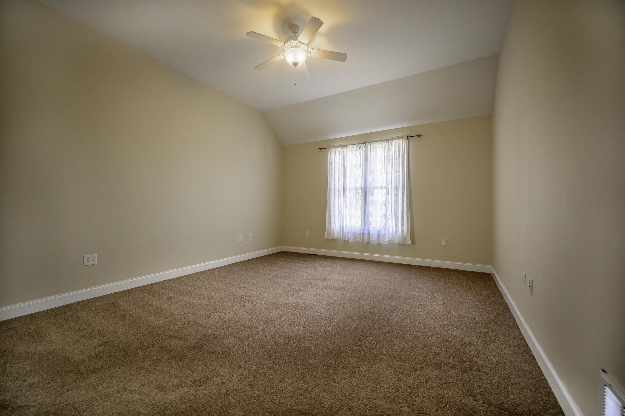 120 Springridge Lane Fairfield, VA 24435 - Photo 35 of 56 an empty room with windows and fan