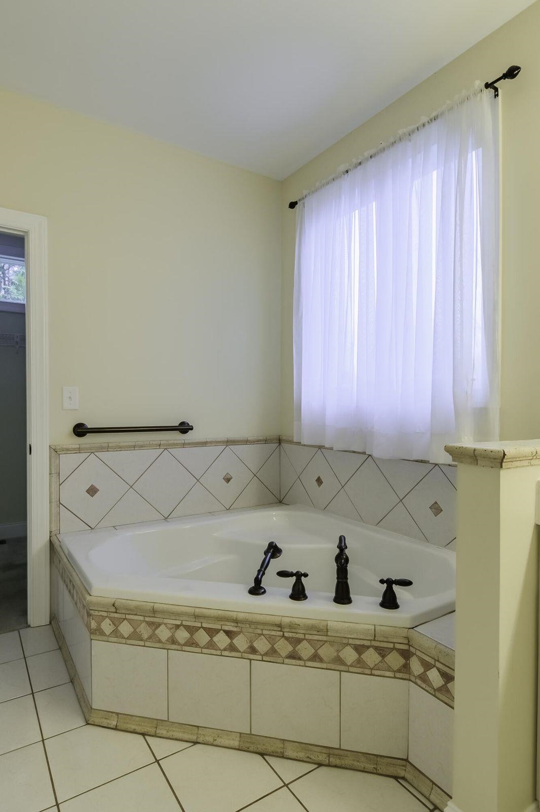 120 Springridge Lane Fairfield, VA 24435 - Photo 39 of 56 a bath tub sitting in a bathroom next to a window