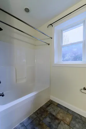 a view of a backyard with sitting area