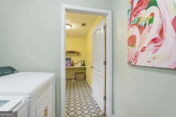 a bathroom with a sink and a view of bathroom