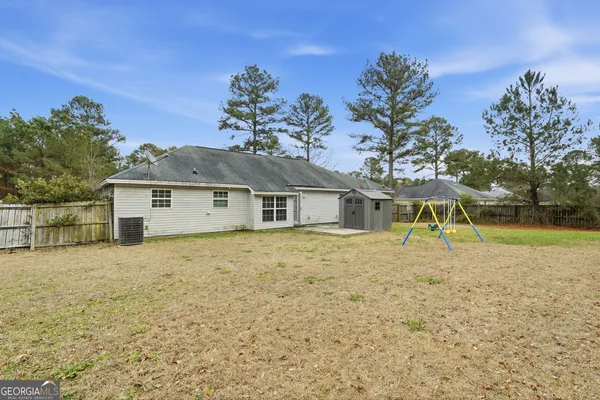 a house with trees in the background