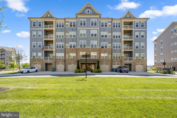 a view of a building with a yard