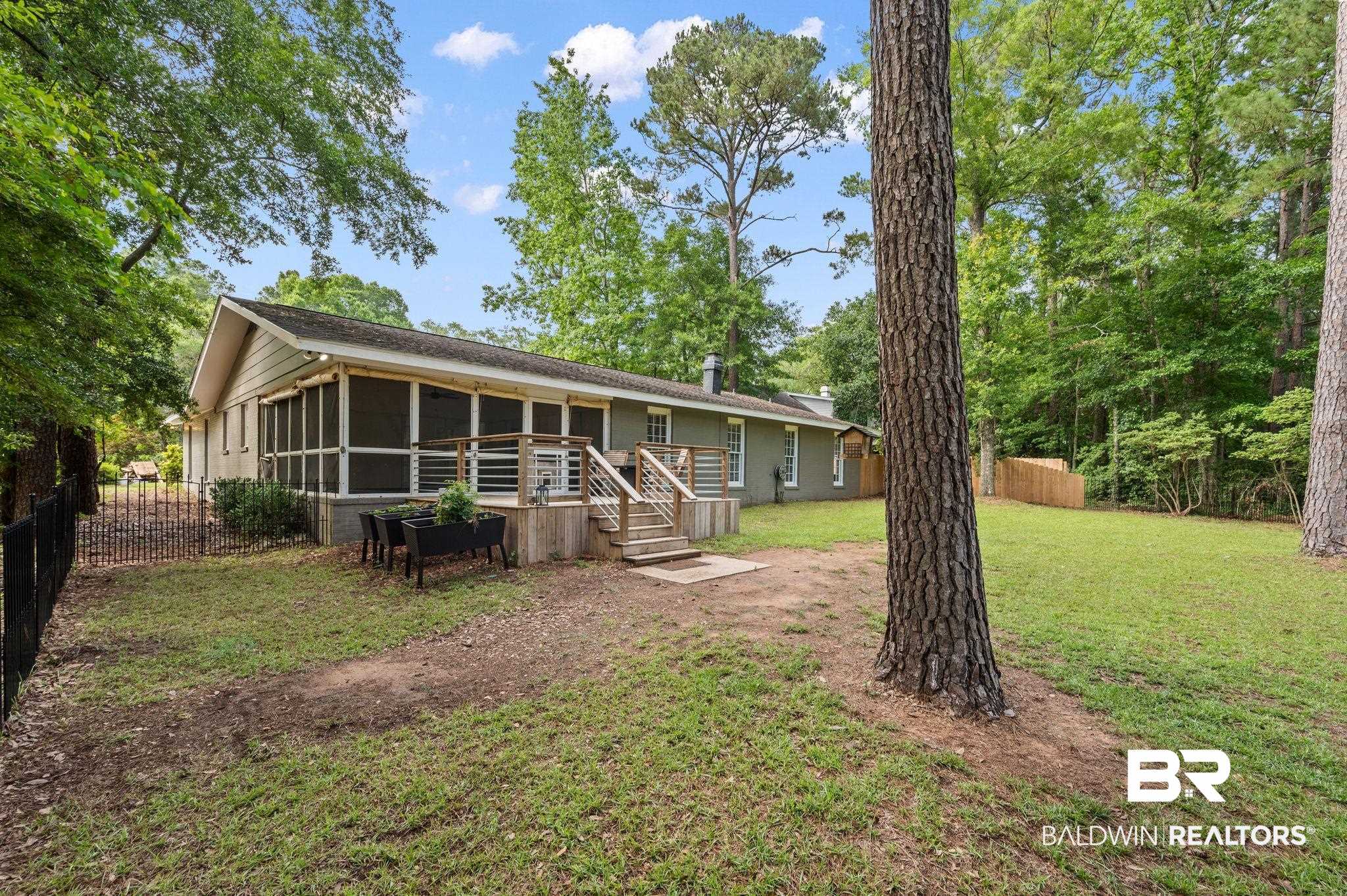 110 Ferncliff Circle Daphne, AL 36526 - Photo 36 of 40 View of back yard with a sunroom and a deck