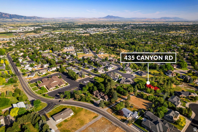 435 Canyon Road Millville, UT 84326 - Photo 107 of 113 Expansive aerial perspective showcasing a residential neighborhood with varied housing styles and mature trees
