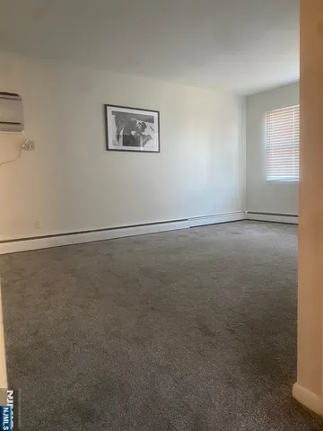 a kitchen with a refrigerator and a sink