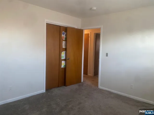 a view of hallway with closet