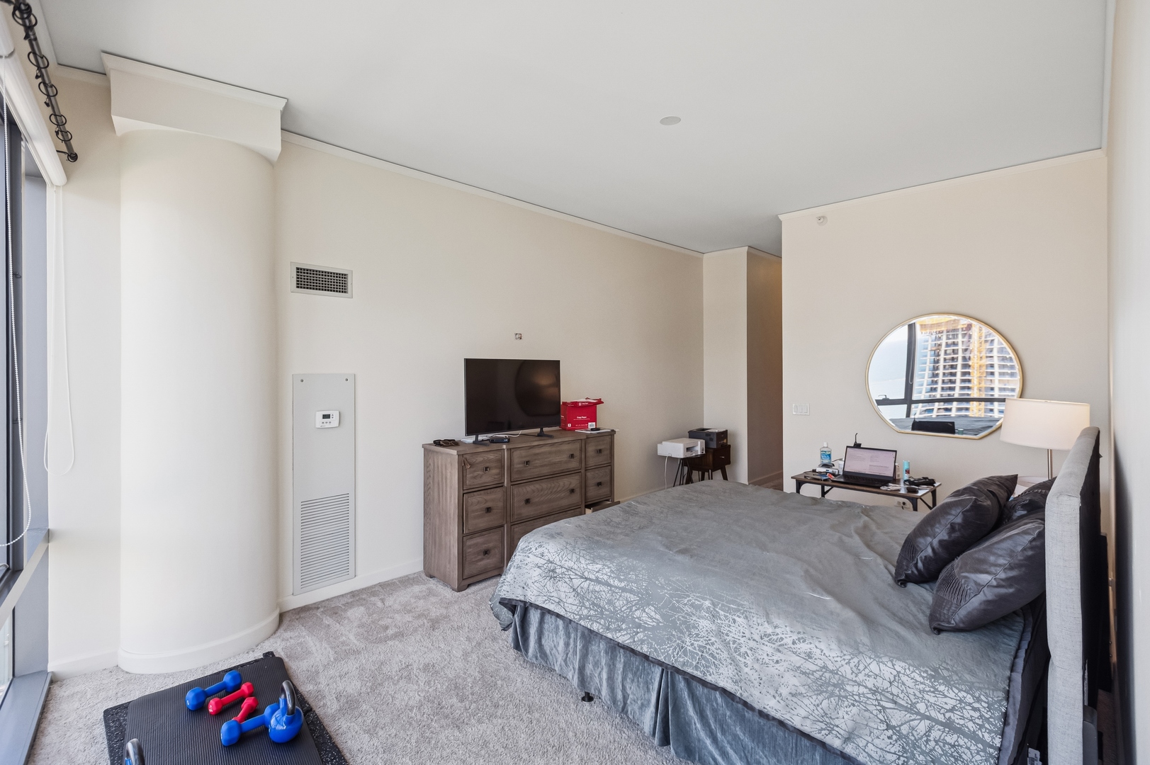 450 East Waterside Drive, Unit 2902 Chicago, IL 60601 - Photo 11 of 44 a bedroom with a bed and a flat screen television