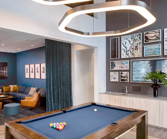 a view of a room with a table and chairs