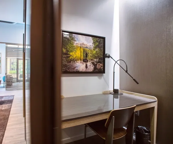 a couple of chairs sitting in front of a window