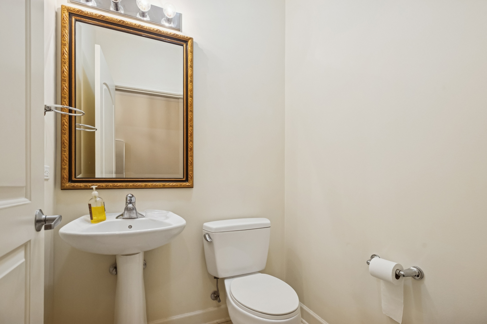 450 East Waterside Drive, Unit 2902 Chicago, IL 60601 - Photo 9 of 44 a bathroom with a toilet sink and mirror