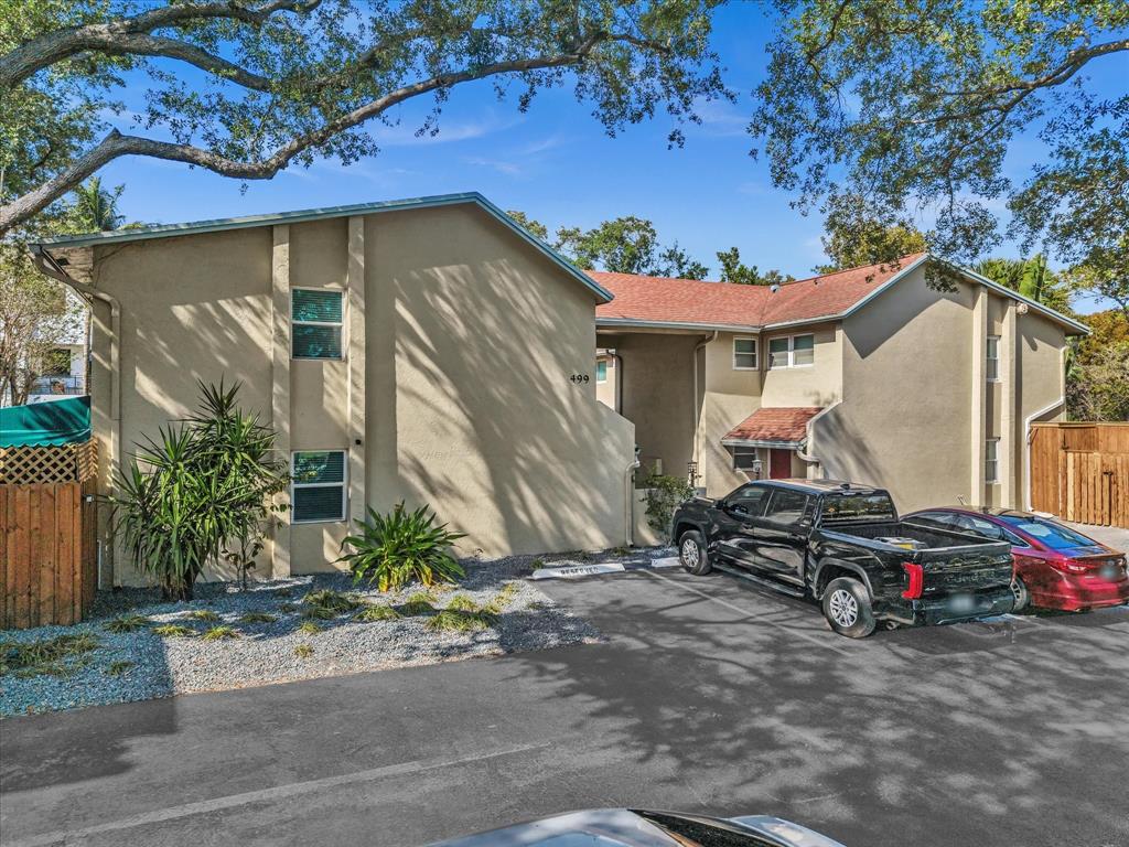 a view of a car park in front of house