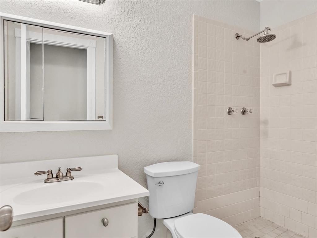 499 Southeast 13th Street, Unit 8E Fort Lauderdale, FL 33316 - Photo 24 of 34 a bathroom with a sink toilet and mirror
