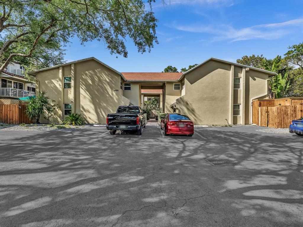 499 Southeast 13th Street, Unit 8E Fort Lauderdale, FL 33316 - Photo 31 of 34 a car parked in front of a house