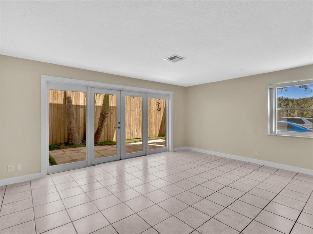 499 Southeast 13th Street, Unit 8E Fort Lauderdale, FL 33316 - Photo 5 of 34 a view of an empty room and window