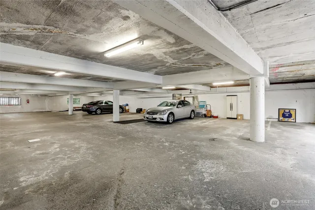 a view of parking area with parked cars