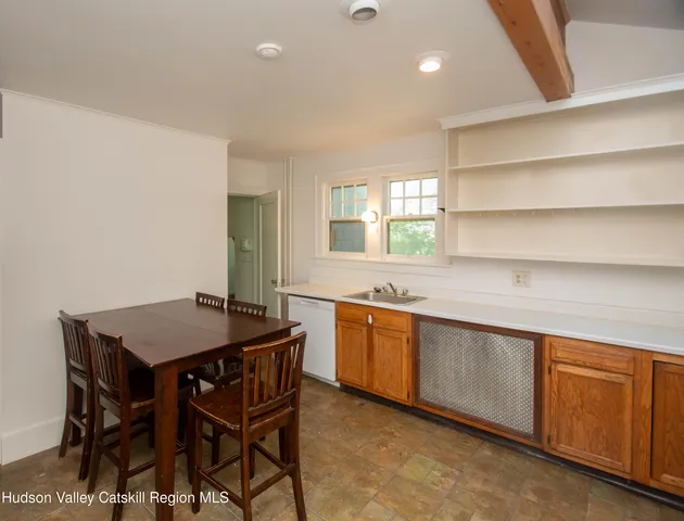 a kitchen with a stove a sink and a refrigerator