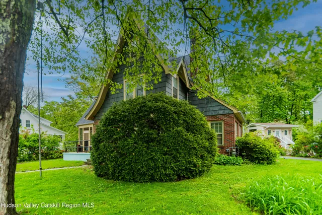 a view of a house with a small yard