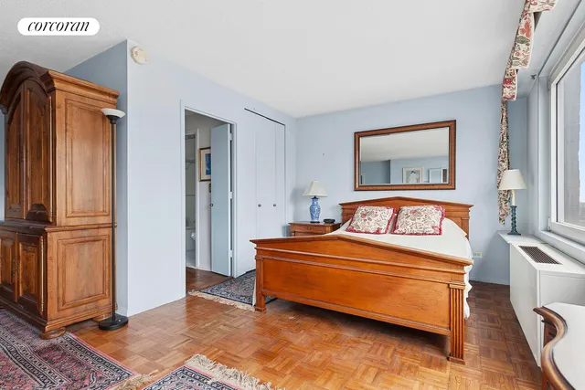 a living room with furniture a rug and a window