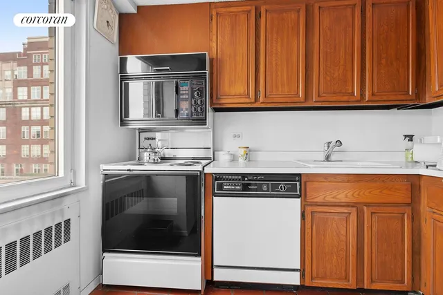 a bedroom with a bed and a cabinets