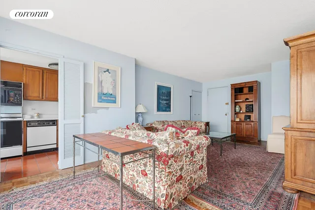a kitchen with stainless steel appliances granite countertop a sink and cabinets with wooden floor