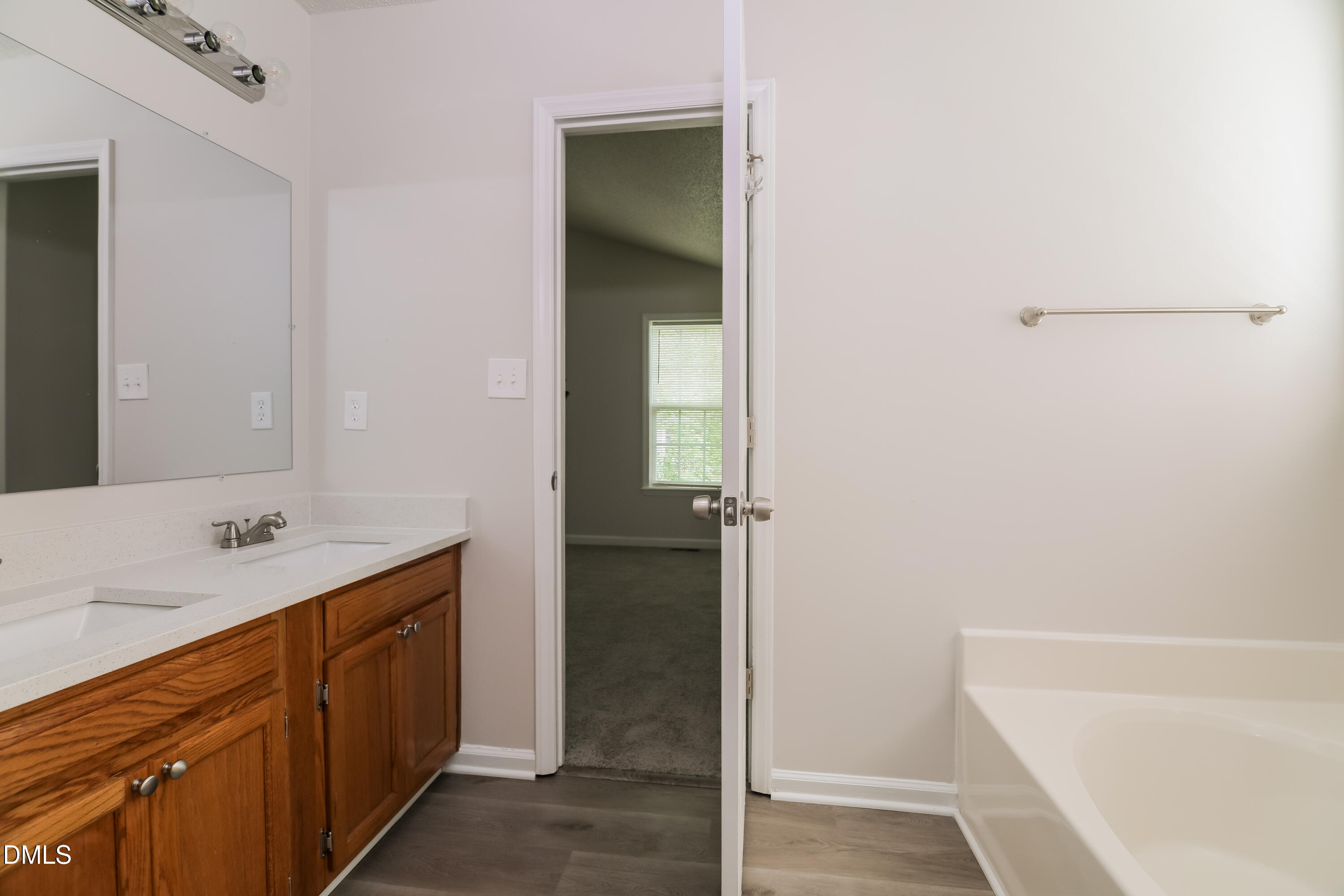 5201 Pronghorn Lane Raleigh, NC 27610 - Photo 11 of 16 a bathroom with a sink and a bathtub