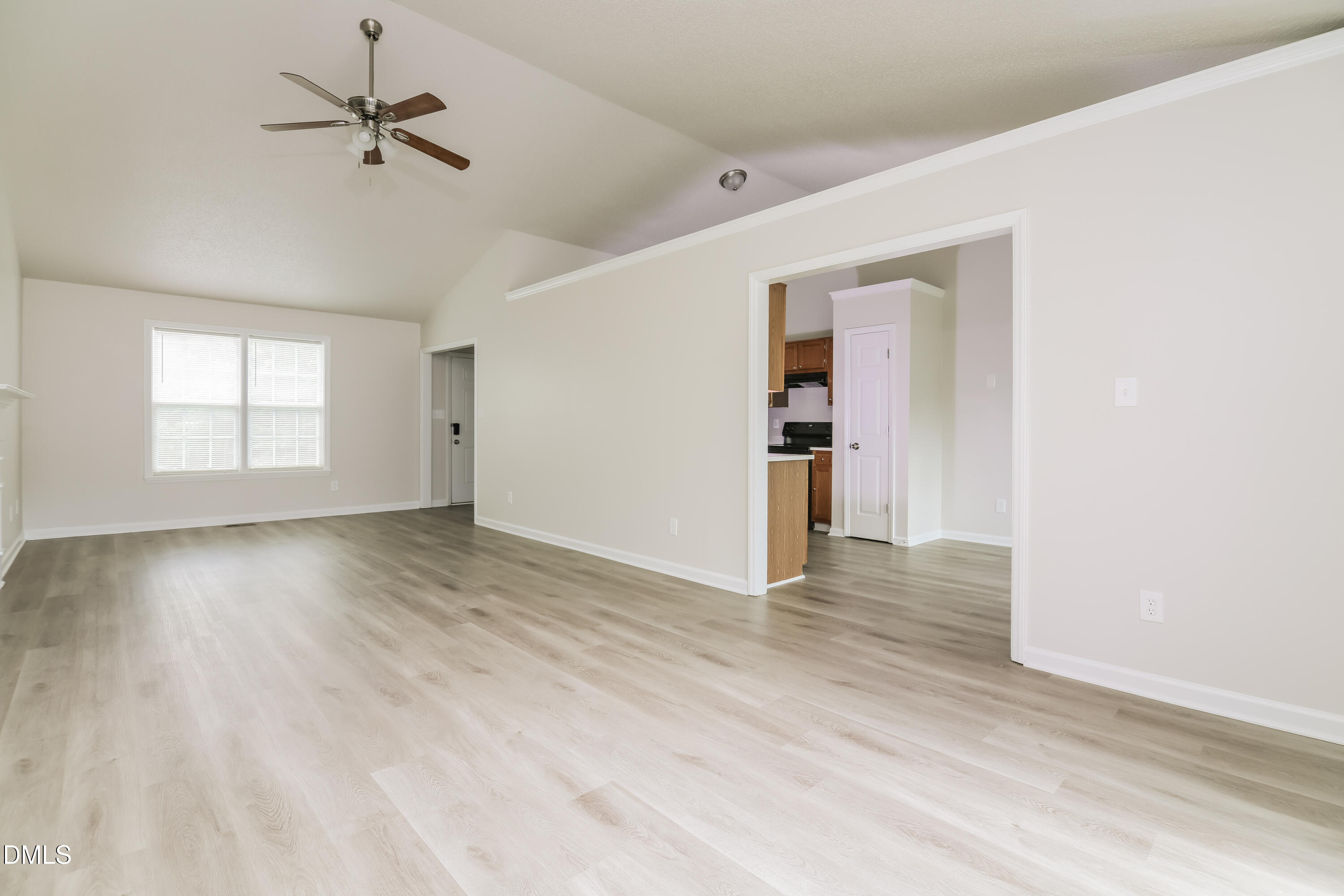 5201 Pronghorn Lane Raleigh, NC 27610 - Photo 3 of 16 wooden floor in an empty room with a window