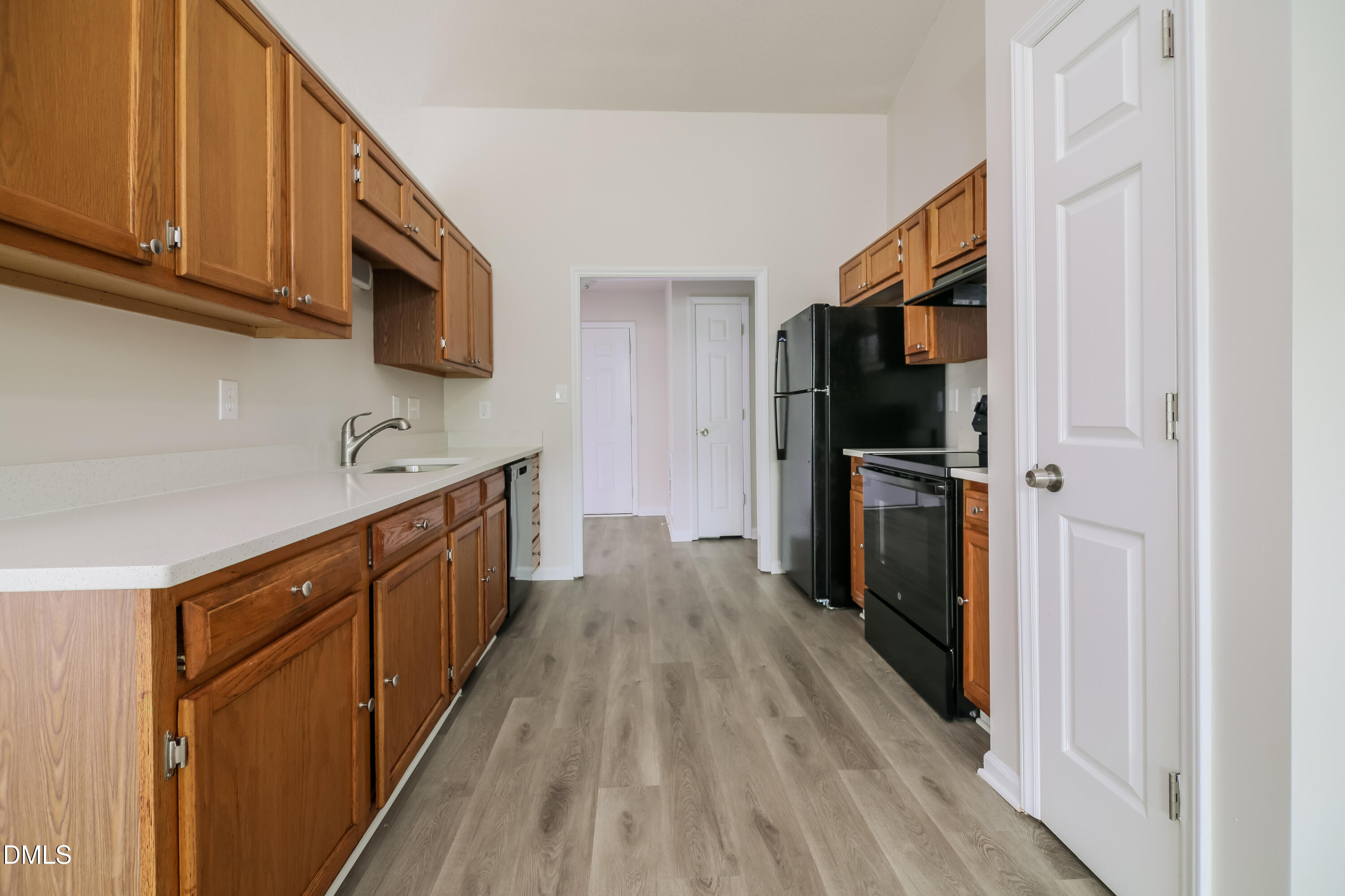 5201 Pronghorn Lane Raleigh, NC 27610 - Photo 6 of 16 a kitchen with stainless steel appliances granite countertop a refrigerator a stove top oven a sink and dishwasher