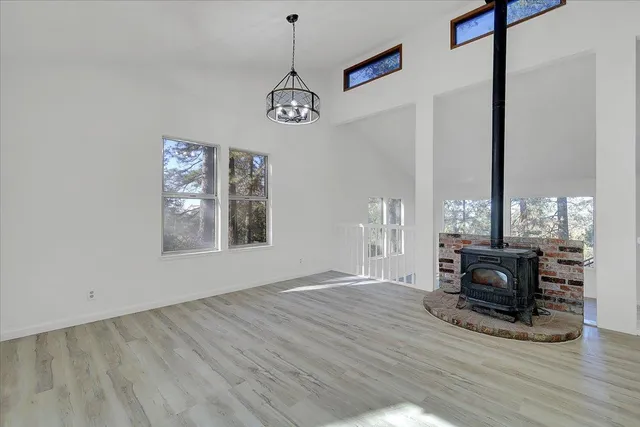 a view of a livingroom with furniture window and wooden floor